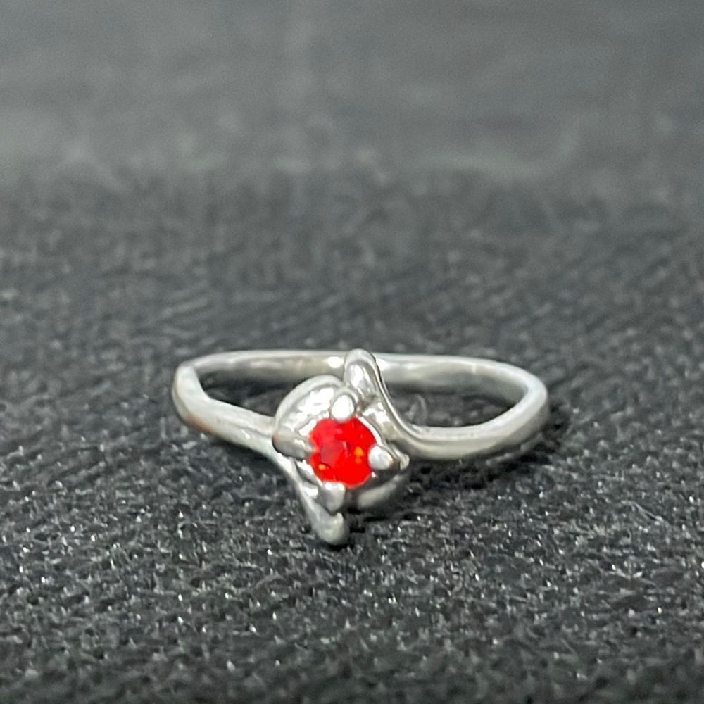 Thin ring with a red gem